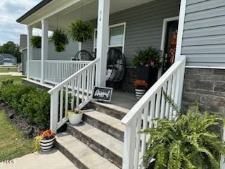 entrance to property featuring a porch