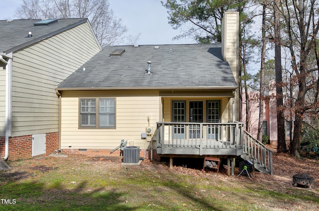 rear view of house with crawl space, a chimney, cooling unit, and roof with shingles