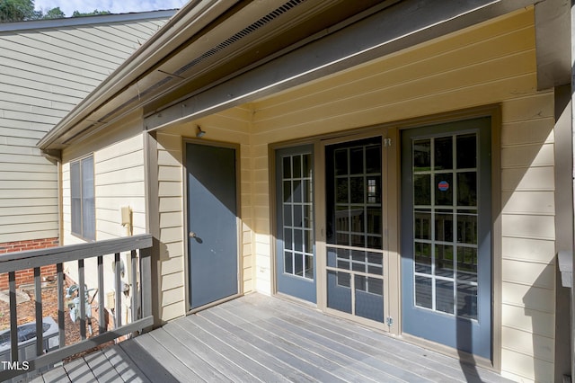 property entrance with brick siding and central air condition unit