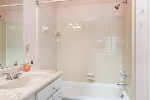 bathroom with vanity and bathing tub / shower combination