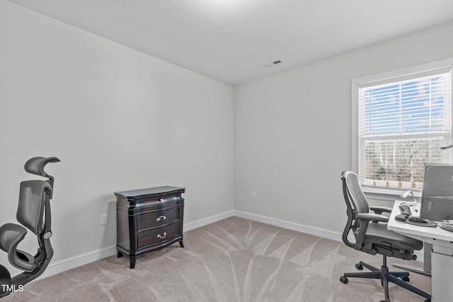 home office featuring carpet floors, visible vents, and baseboards