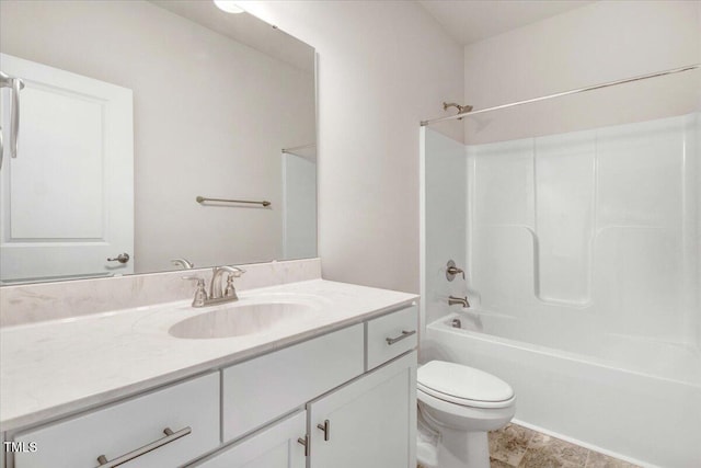 bathroom featuring shower / washtub combination, vanity, and toilet