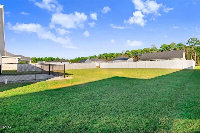 view of yard with a fenced backyard