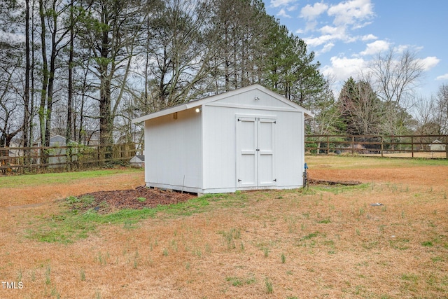 view of shed with fence