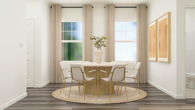 sitting room featuring baseboards and wood finished floors