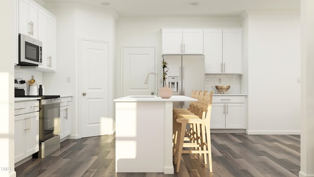 kitchen featuring dark wood-style floors, appliances with stainless steel finishes, a sink, and crown molding