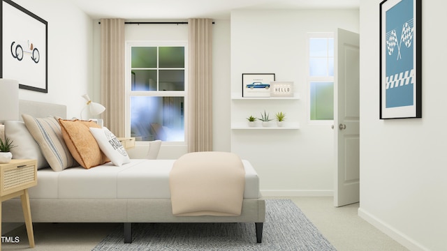 bedroom with carpet and baseboards