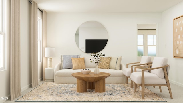 sitting room featuring carpet flooring and baseboards