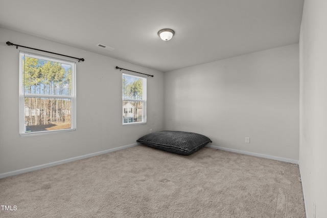 bedroom with baseboards, visible vents, and carpet flooring