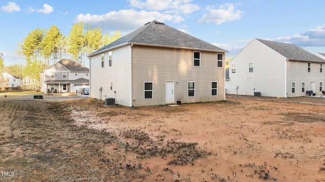 back of house featuring central AC