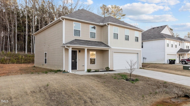 traditional-style house with an attached garage and concrete driveway