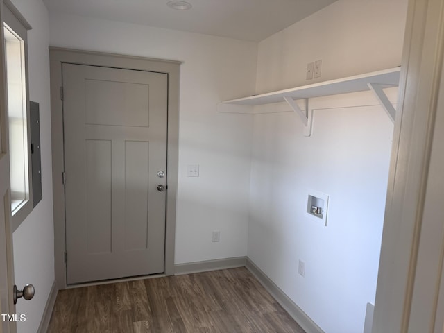 clothes washing area with hookup for a washing machine, laundry area, baseboards, and dark wood-style floors