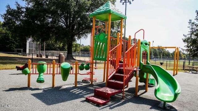 community jungle gym with fence