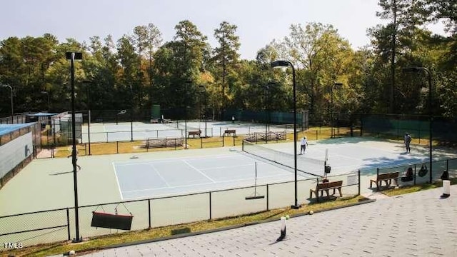 view of sport court with fence