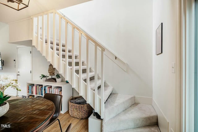 stairs with wood finished floors