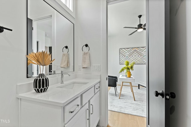 bathroom with vanity, wood finished floors, and a ceiling fan