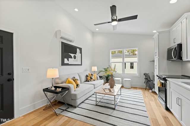 living room with lofted ceiling, recessed lighting, baseboards, a wall mounted AC, and light wood-type flooring