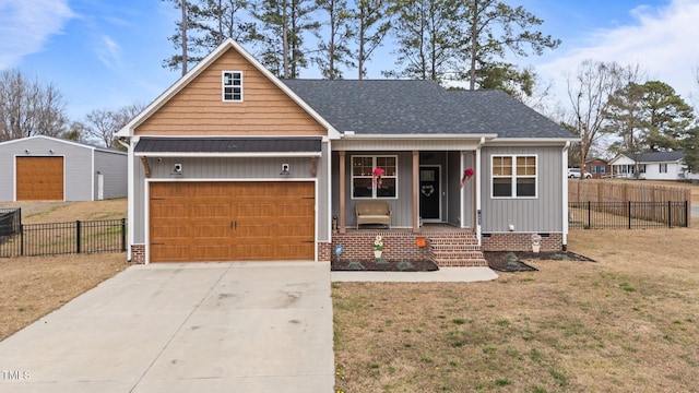 view of front facade with a garage, a front yard, concrete driveway, and fence