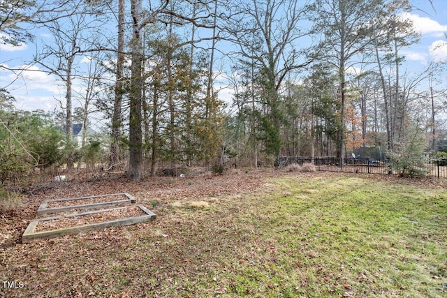 view of yard with a garden and fence