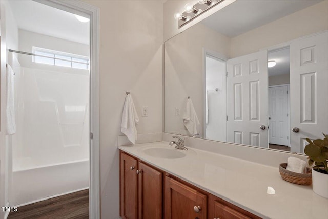 bathroom with shower / bathtub combination and vanity