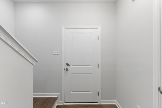 entryway featuring wood finished floors and baseboards