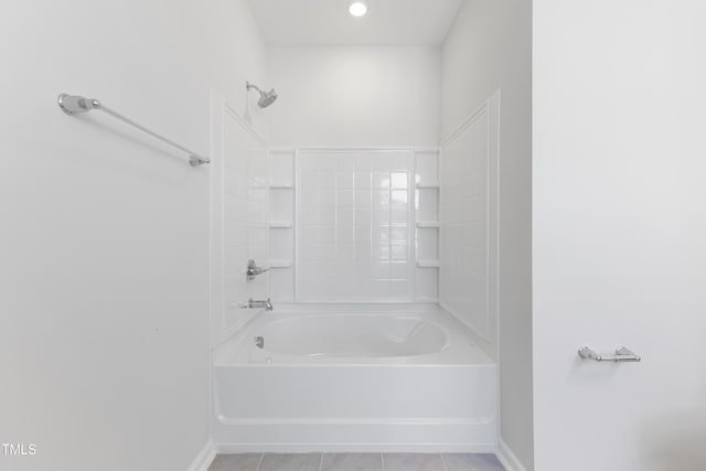 full bath featuring bathtub / shower combination, baseboards, and tile patterned floors