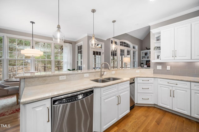 kitchen featuring light wood-style flooring, a sink, open shelves, decorative backsplash, and dishwasher