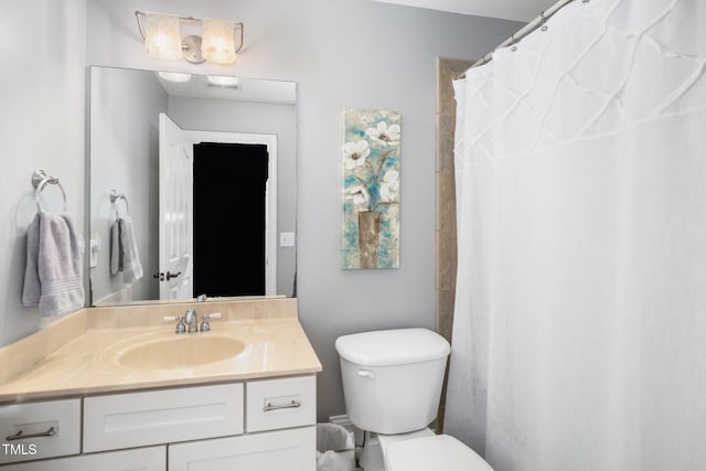 bathroom with a shower with curtain, toilet, and vanity