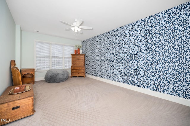 miscellaneous room with wallpapered walls, baseboards, and ceiling fan