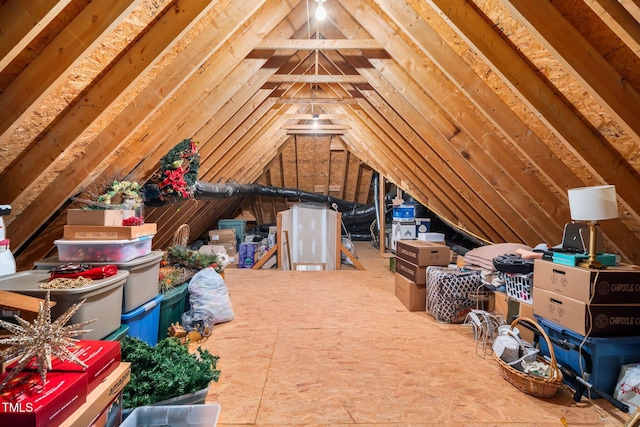 unfinished attic featuring an upstairs landing