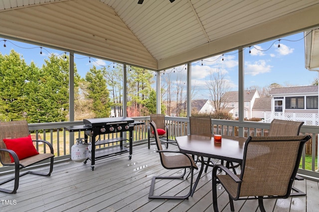 sunroom with vaulted ceiling