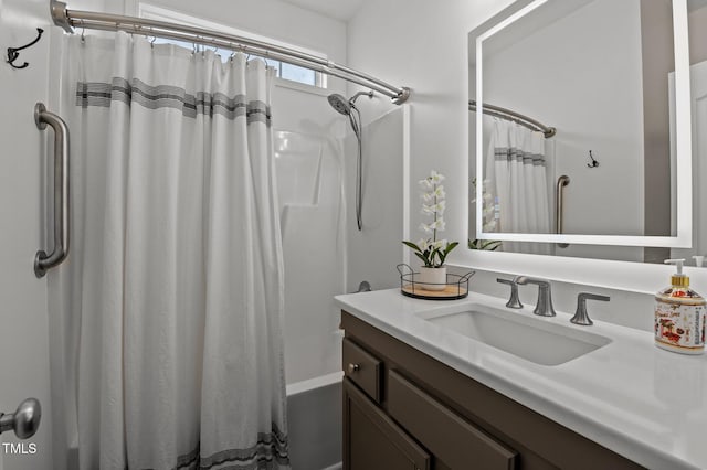 bathroom with shower / bath combo and vanity