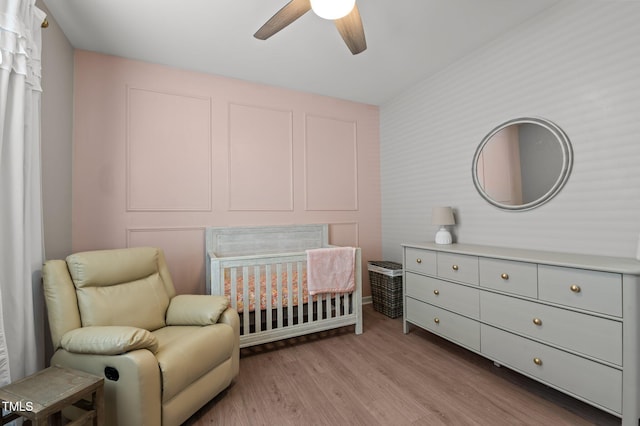 bedroom with light wood-type flooring and ceiling fan