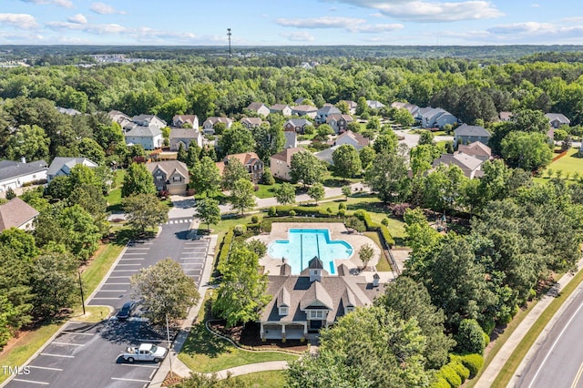 aerial view with a residential view and a view of trees