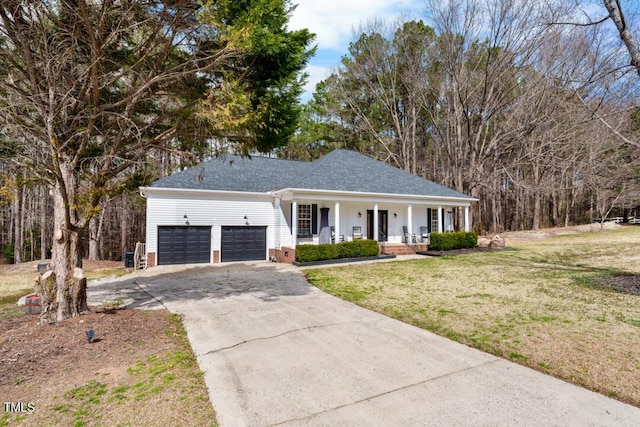 view of front of property featuring a garage, a front yard, covered porch, and driveway