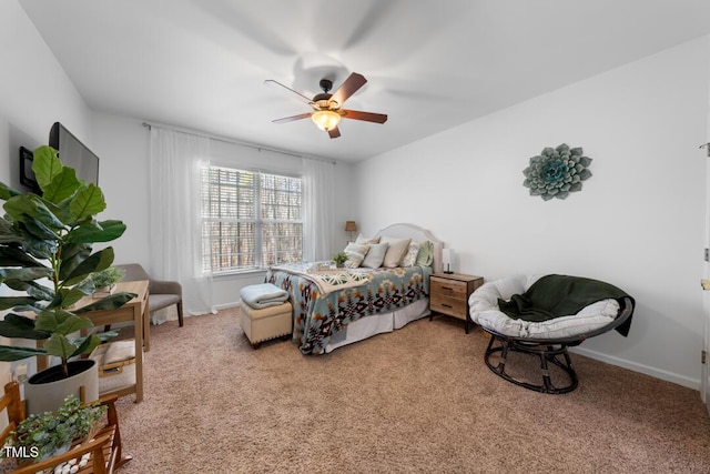 carpeted bedroom featuring ceiling fan and baseboards