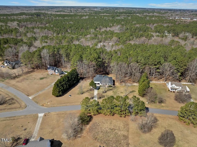 aerial view featuring a view of trees