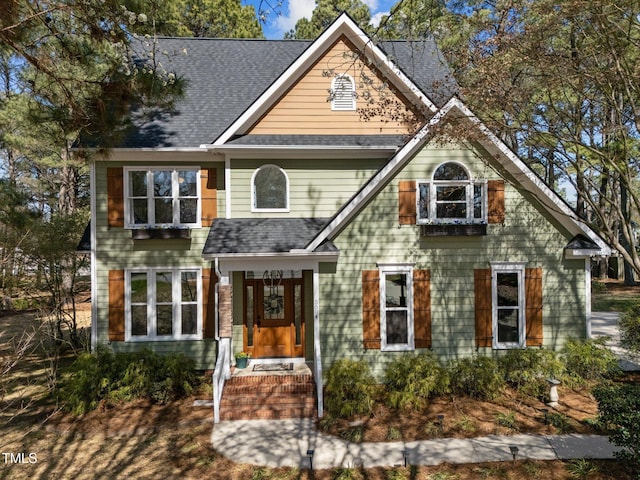 view of front of house with roof with shingles