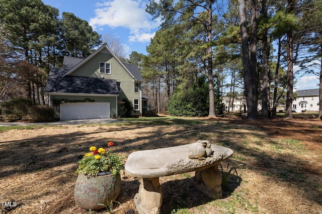 view of side of home featuring a garage