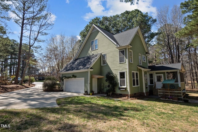 view of side of property with crawl space, a lawn, concrete driveway, and roof with shingles