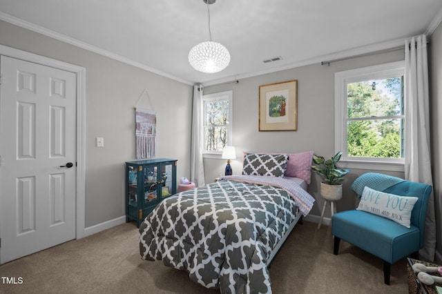 carpeted bedroom with crown molding, baseboards, and visible vents