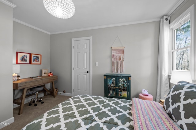 carpeted bedroom featuring crown molding and baseboards