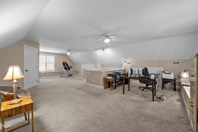 home office featuring baseboards, lofted ceiling, carpet, and ceiling fan