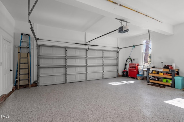 garage featuring a garage door opener