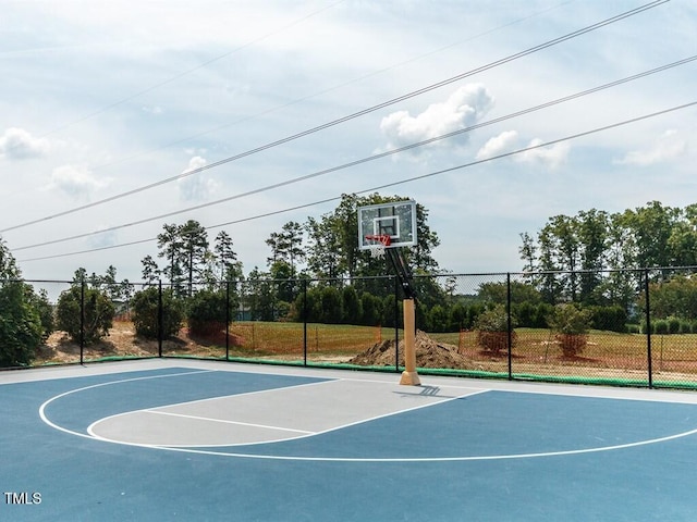 view of basketball court featuring community basketball court and fence