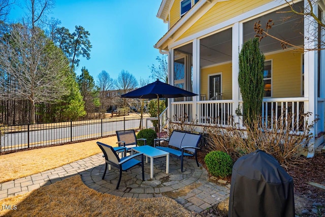 view of patio with covered porch, fence, and grilling area