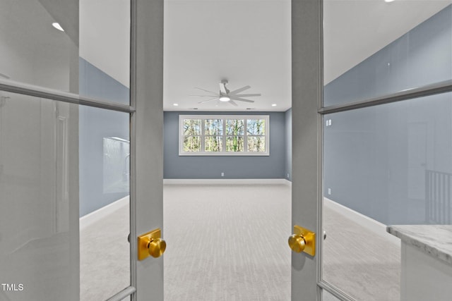 interior space featuring recessed lighting, ceiling fan, and baseboards