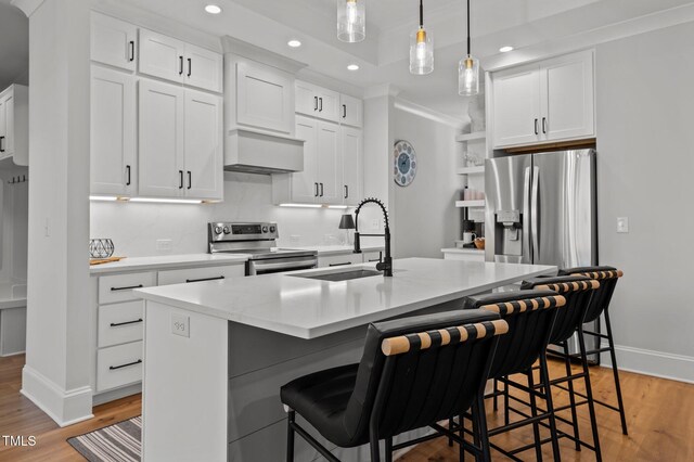 112 Rawhide Dr, Louisburg, NC 27549 - kitchen with light countertops, open shelves, premium range hood, stainless steel appliances, and a sink