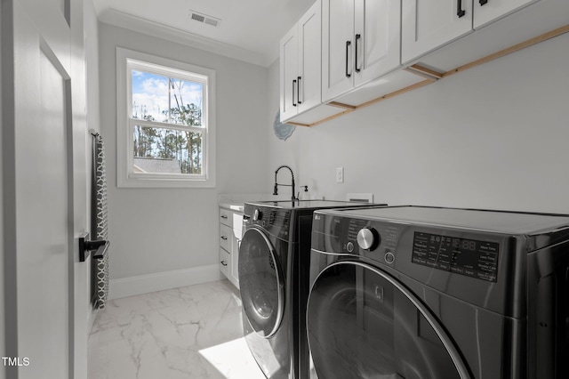 112 Rawhide Dr, Louisburg, NC 27549 - washroom with visible vents, baseboards, marble finish floor, cabinet space, and washer and clothes dryer