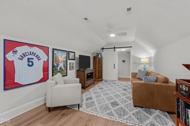112 Rawhide Dr, Louisburg, NC 27549 - living area featuring baseboards, lofted ceiling, visible vents, and wood finished floors